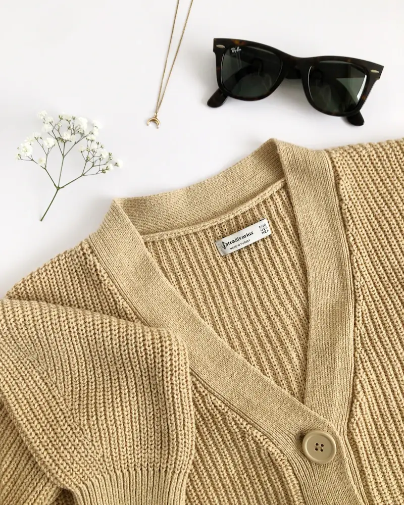 Oat lambswool cardigan laid flat