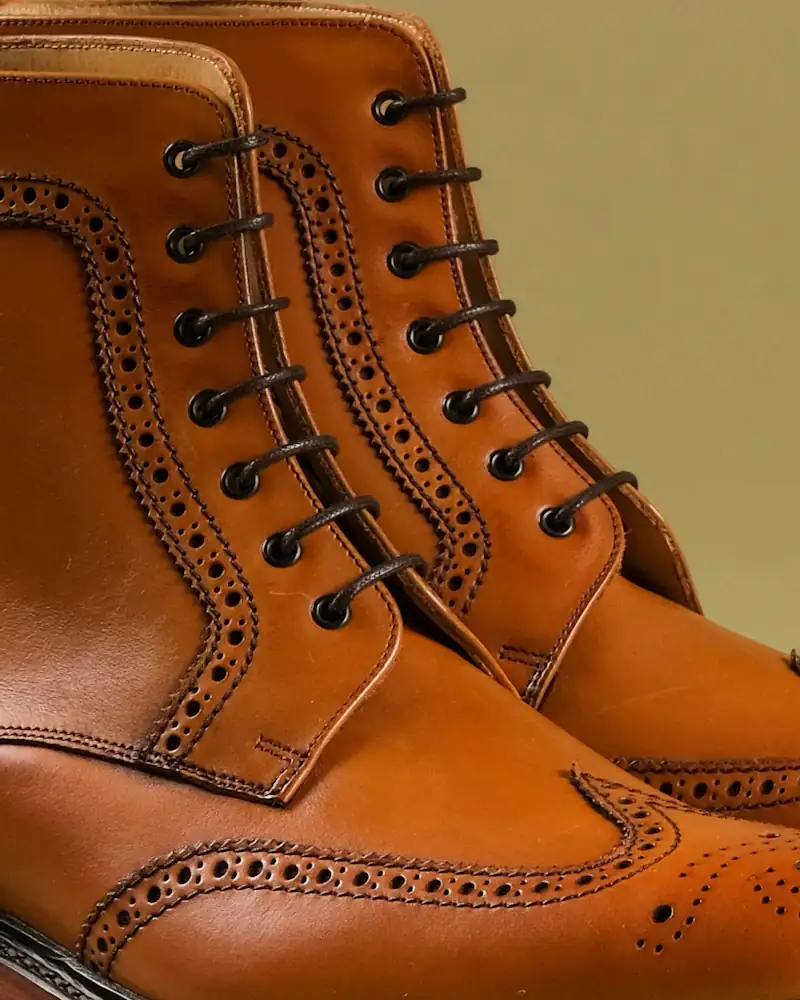 Tobacco leather brogue boots, close-up