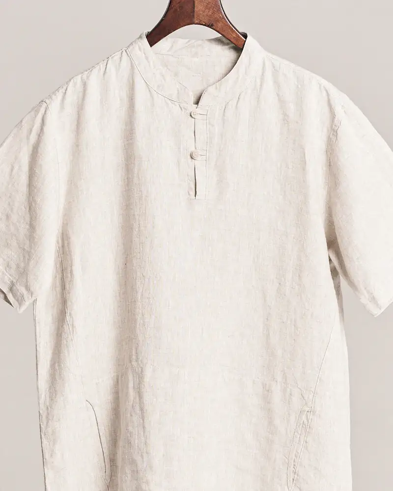 Sand linen shirt hanging from a branch, close-up