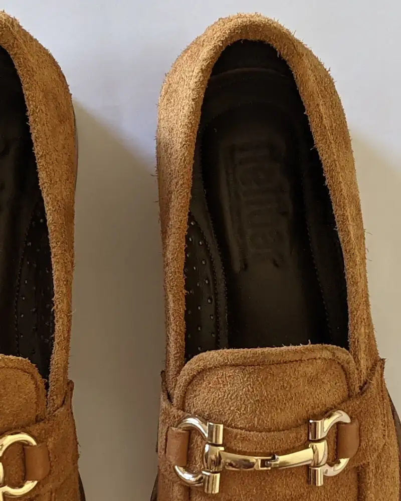 Camel velvet loafers with gold hardware, close-up