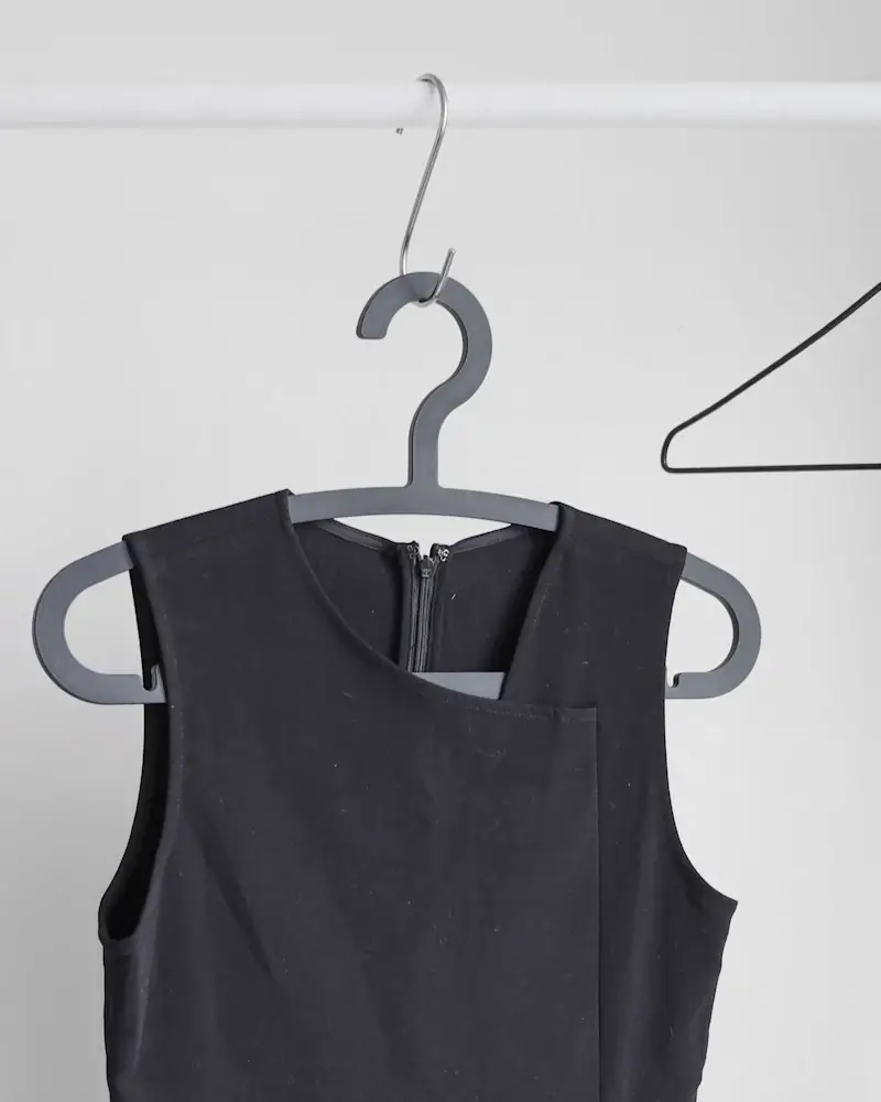 Midnight sleeveless dress on a grey hanger
